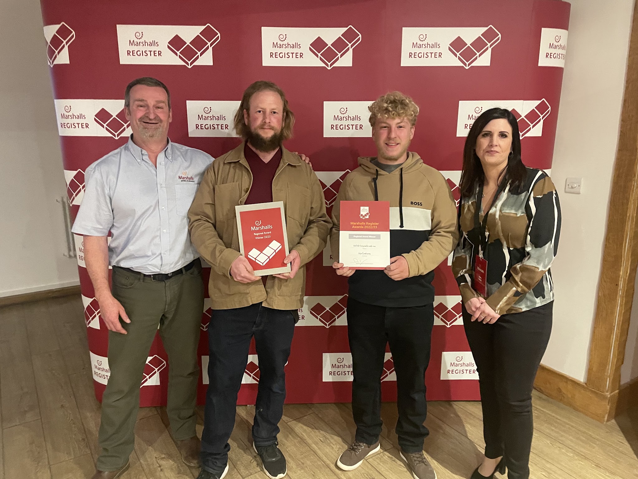 The Project Landscaping team receiving their Marshalls Register award certificates