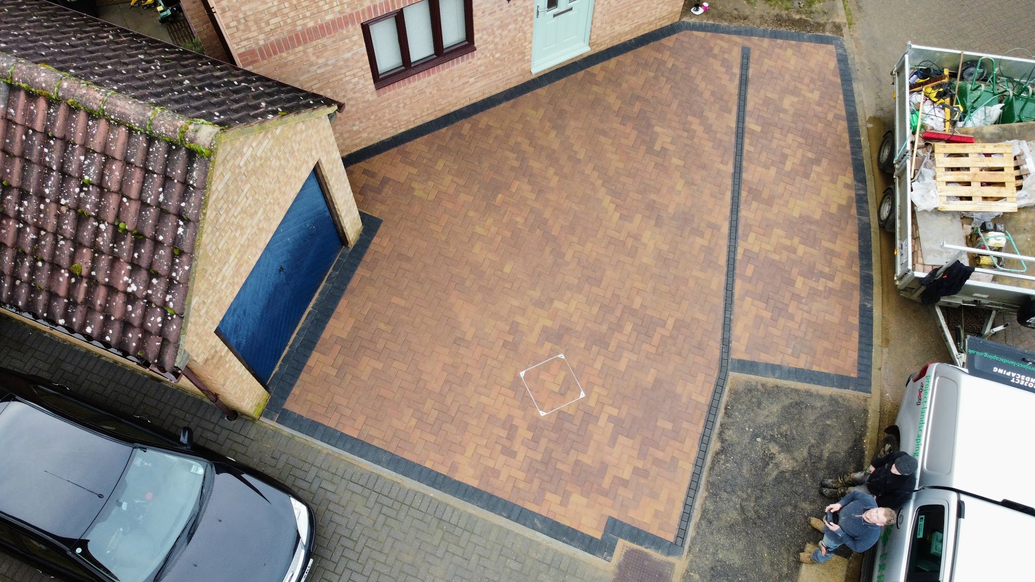 Drone view of a newly block paved driveway with a contrasting border